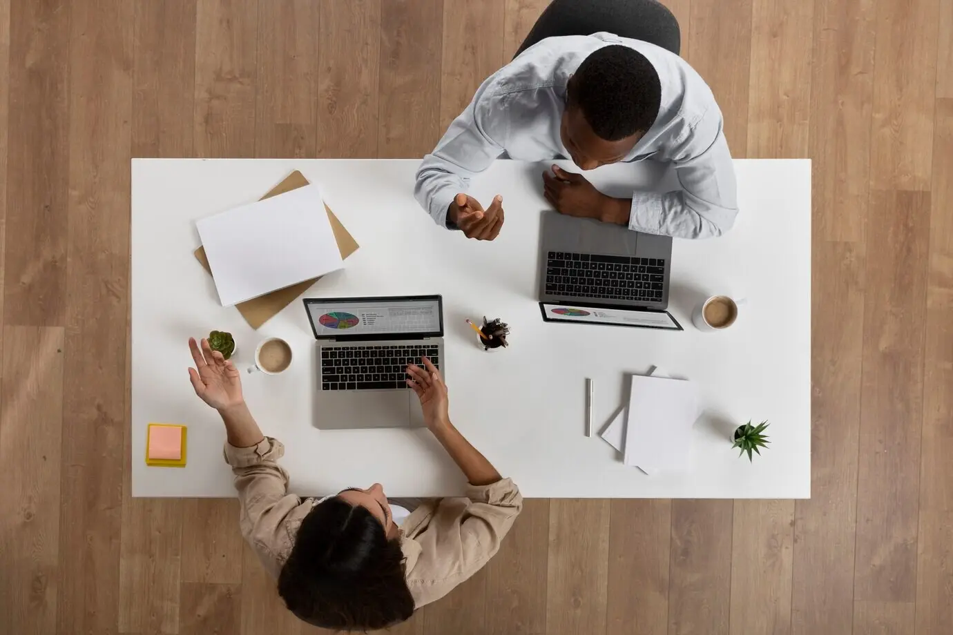 Overhead view of people working together at the office
