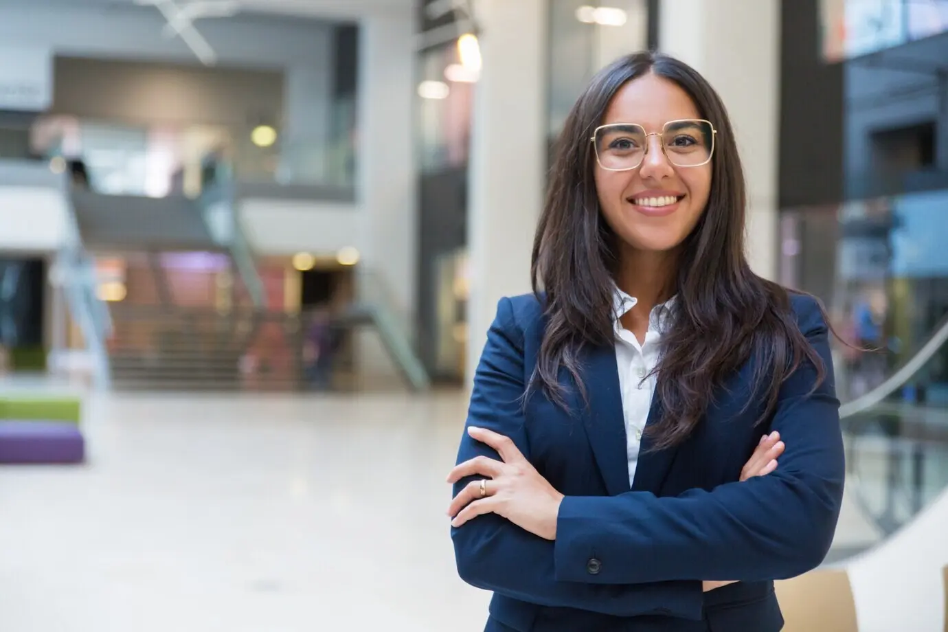 A young businesswoman smiling at the camera.